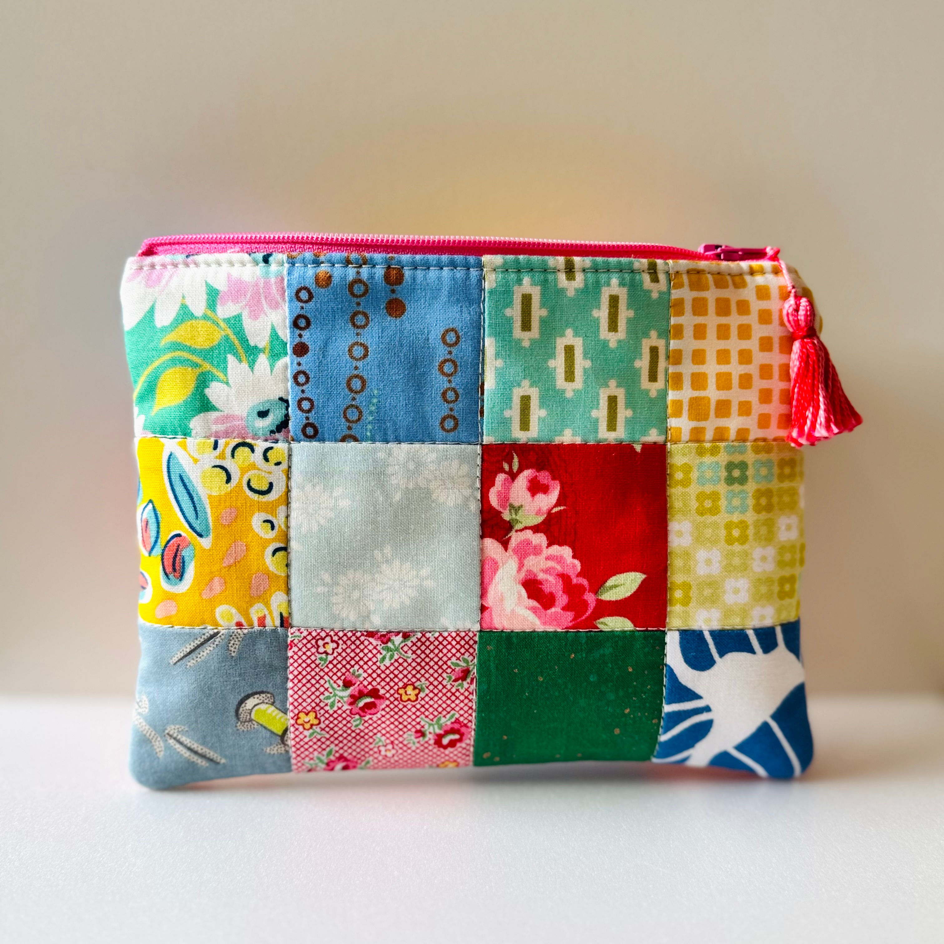 Small patchwork zip pouch scrappy colourful designs