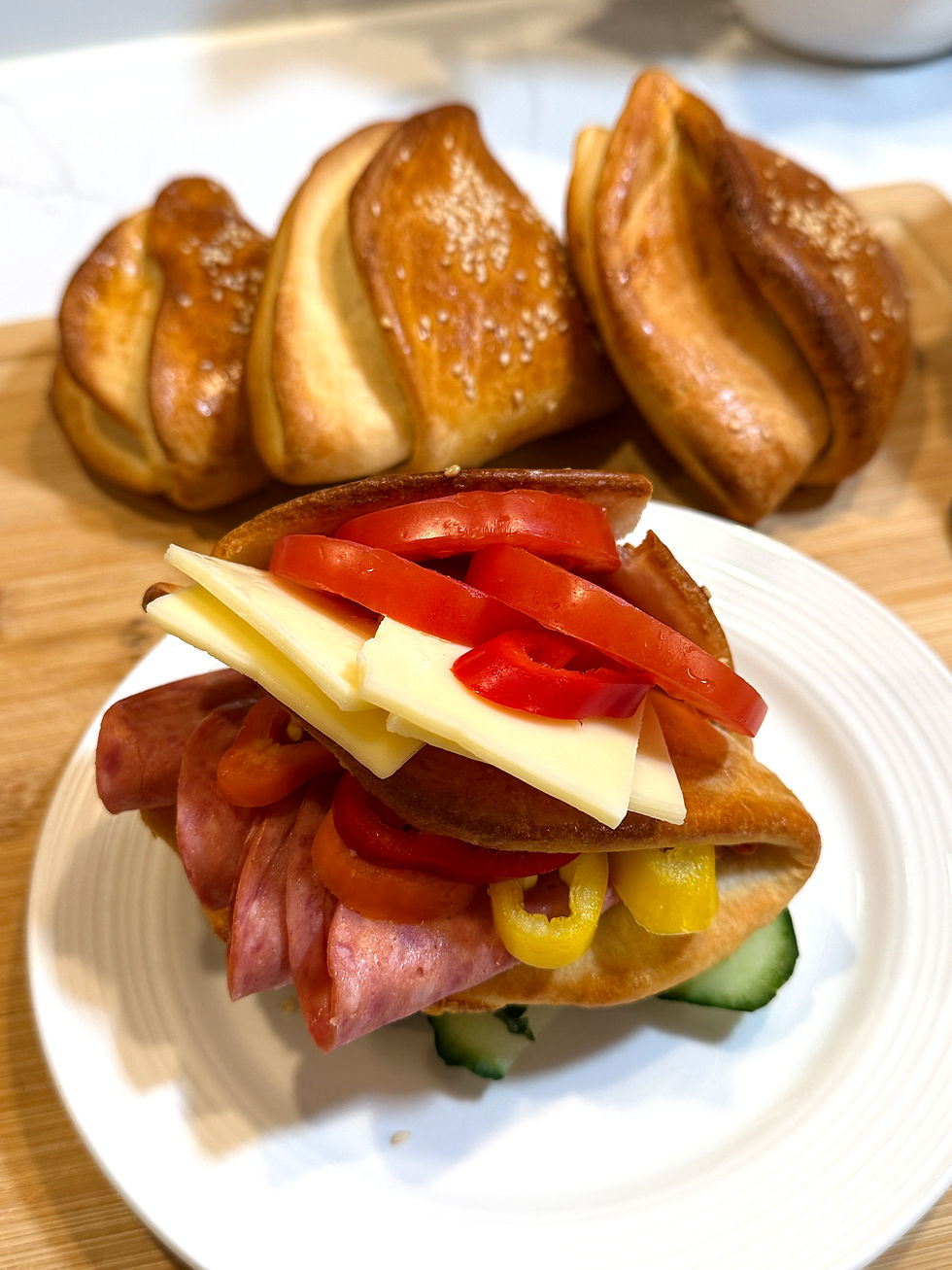Hungarian-style homemade sandwich pocket filled with salami, cheese, tomato, peppers and cucumber.