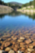 Clear water lake with rocky bottom