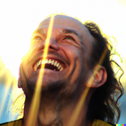 DALL·E 2022-11-10 08.32.02 - a man laughing at the sun spiritual.png