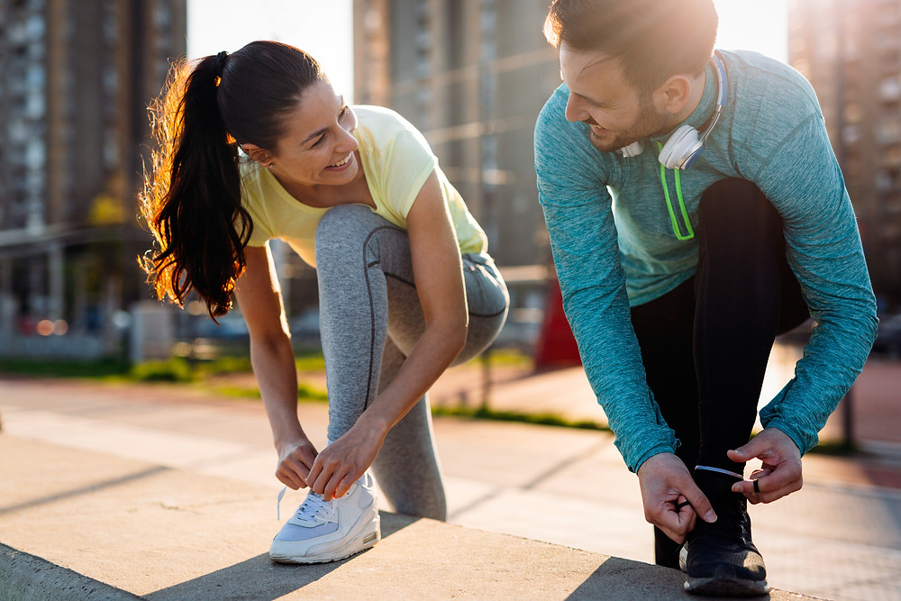 Man and woman prepare to exercise