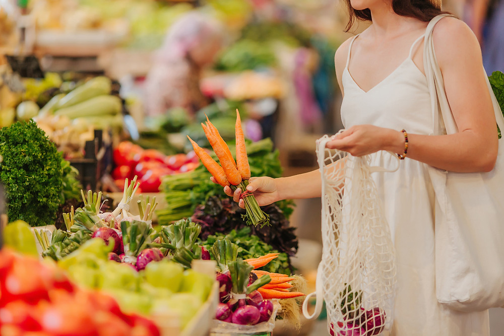 buying carrots at farmers market