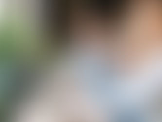 A man referring a co-worker to something