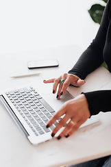A person typing on a keyboard