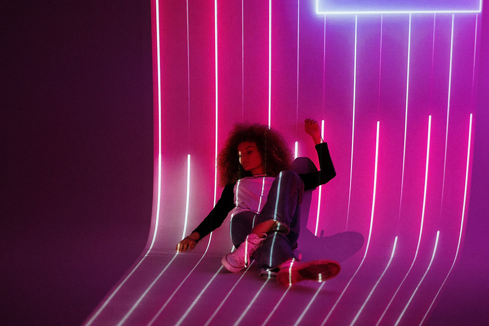 a woman resting in front of futuristic neon light to showcase futuristic vibes