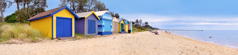 Brightly colored Melbourne property beach boxes at Brighton Beach.
