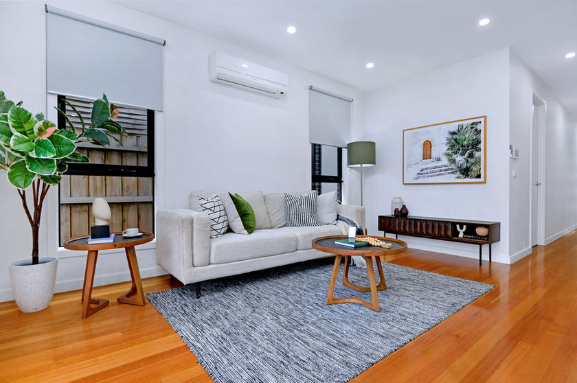 Modern Melbourne property living room with large sofa.