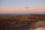 a view of a desert with a moon in the sky_edited.jpg