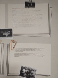 Dous papeis con texto e fotos, suxeitos con clips