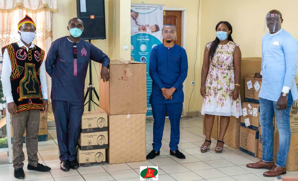 I Am Cameroon team standing in room with boxes of PPE donations