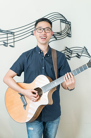 Teaching acoustic guitar at Evan's Music Academy