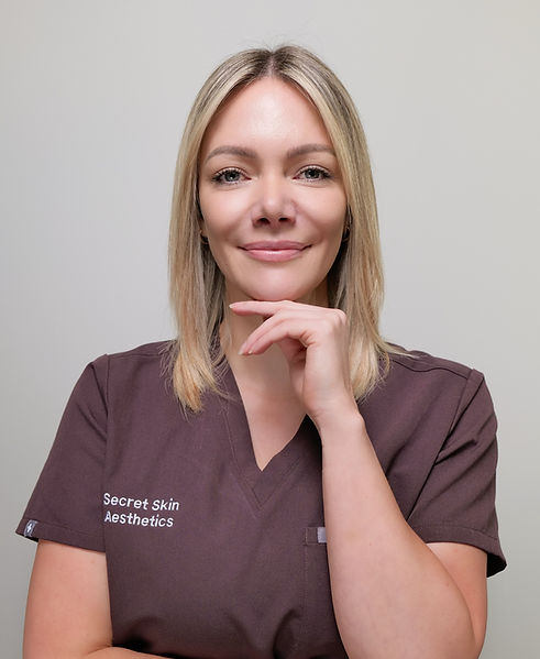 Nurse Louise looking into the camera smiling at Secret Skin Aesthetics in Hampshire