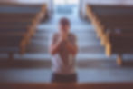 Person Praying Earnestly In Church