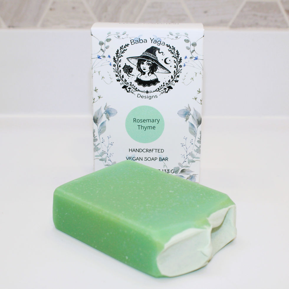 Thumbnail: Rosemary Thyme green soap bar next to a printed soap box with white and tan tile background.