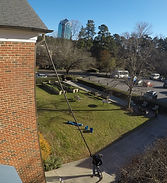 Cleaning gutters on a commercial building