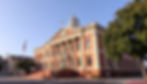 Eye-level view of a Virginia courthouse entrance with steps leading up to the main doors