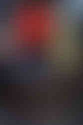 Bright neon signs and bustling crowds at Times Square, New York City.