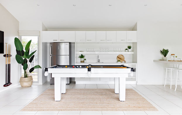 Spacious games room with billiard table and kitchenette at Sundara Beach House