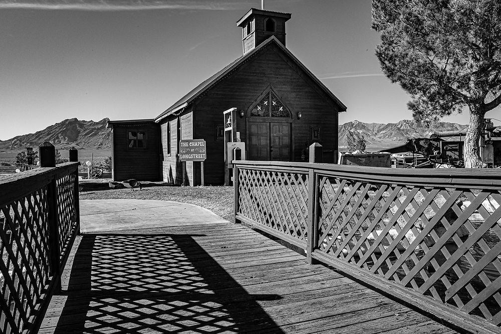 Small wooden church in Death Valley with mountain backdrop