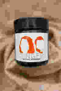 Deodorant jar with "GINGER Natural deodorant" on label
