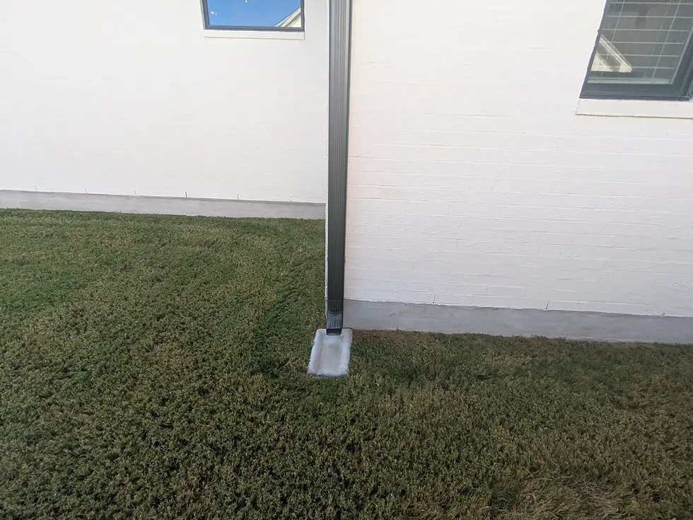 Splashblocks, while better than nothing, technically do not conform to the building code if you have expansive soils.