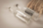 Glass bottles of still and sparkling spring water.
