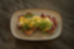 Artisan open sandwich with fresh toppings served on a plate at Lake Street Coffee