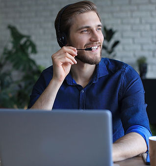 Man on conference call in front of laptop