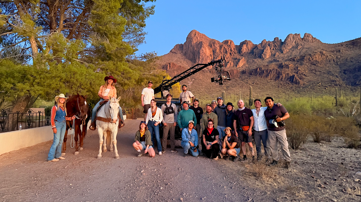 Film crew and people on horseback in the Arizona desert