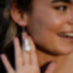 Model wearing Loulou Drop Earrings with twisted gold bar and baroque pearl by Menzaman Jewelry
