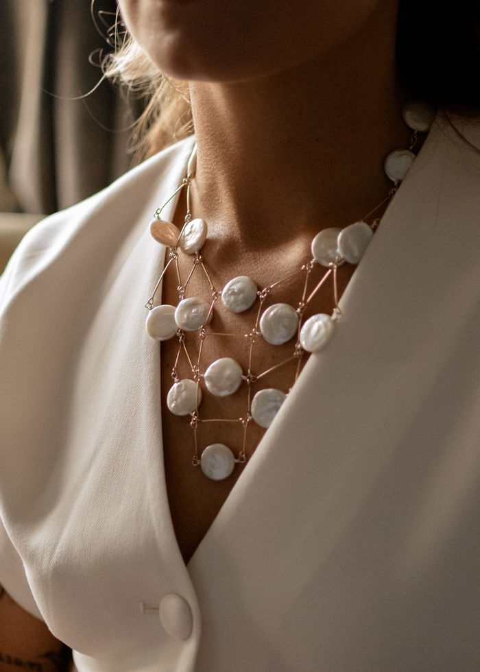 Close-up of Loulou Coin Net Necklace cascade design on model by Menzaman Jewelry