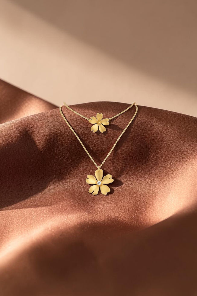 Blossom flower pendant necklace in gold on warm brown silk background — Menzaman Jewelry