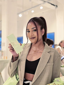 Neha Dubey Art creating live caligraphy during an event for cosmetic brand PIXI in Singapore