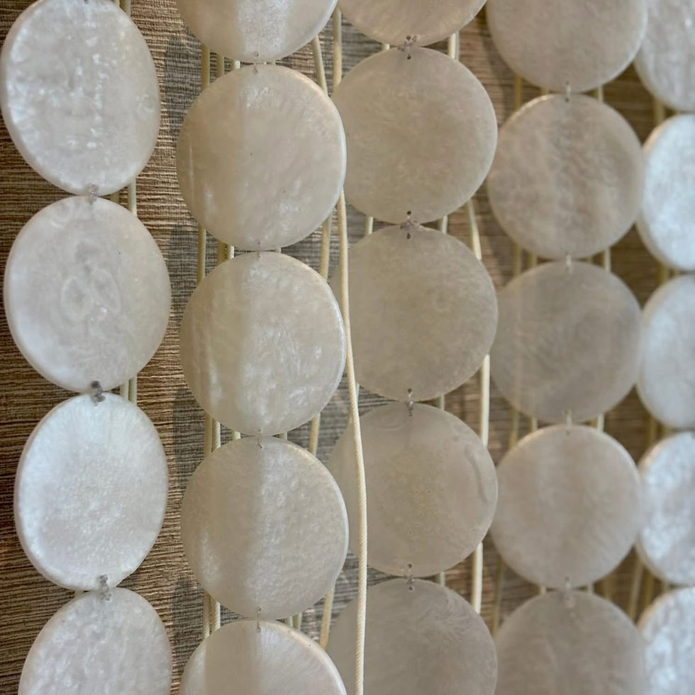 Close-up of handcrafted resin artwork mixed with pearl powder creating depth and luminous texture in luxury Phuket interior