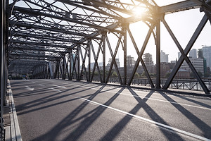 Picture taken on a bridge, with the structure of the side and top in view