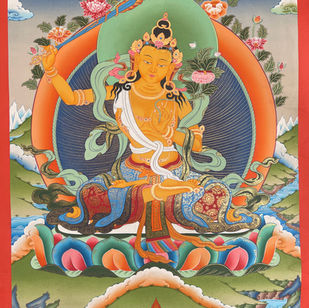 Manjushri Thangka - Manjushree is known as the God of Divine Wisdom. He is usually depicted in a seated position holding a flamed sword in his right hand representing the realization of wisdom that cuts through ignorance and delusion.