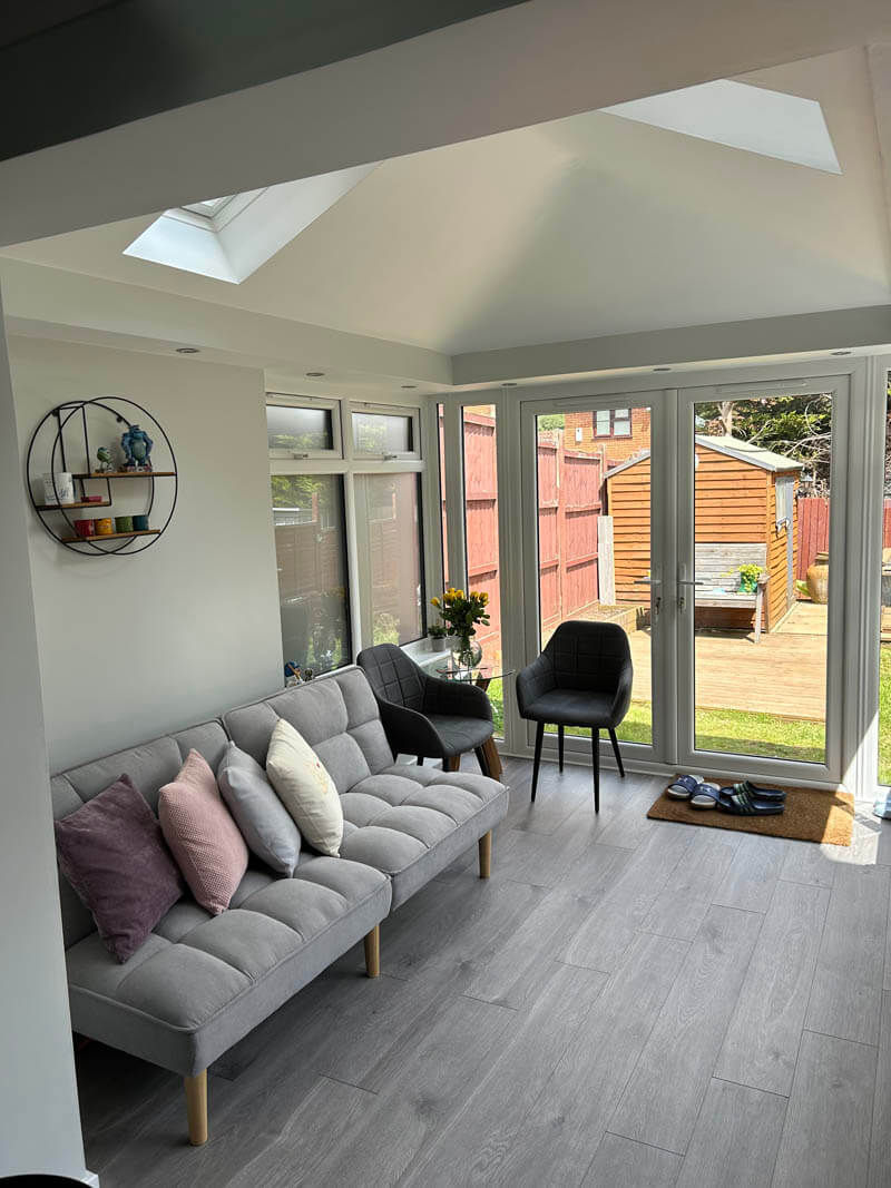 What was once a cold, outdated conservatory is now a warm, stylish, and fully functional space