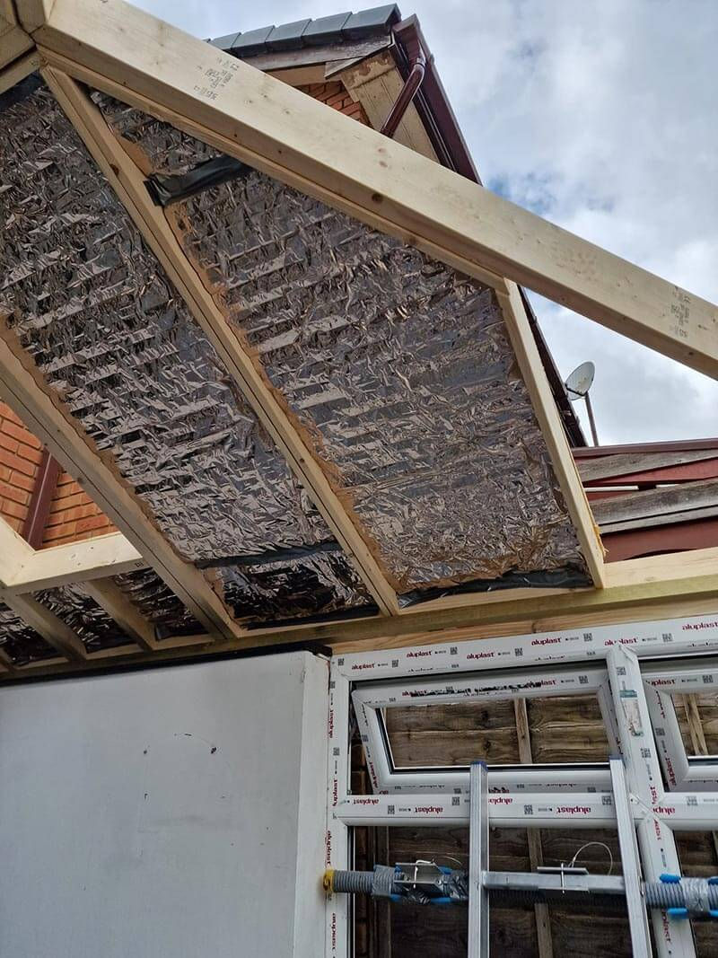 The new conservatory’s double-glazed wall frames were installed and bolted together, creating a very strong structure.