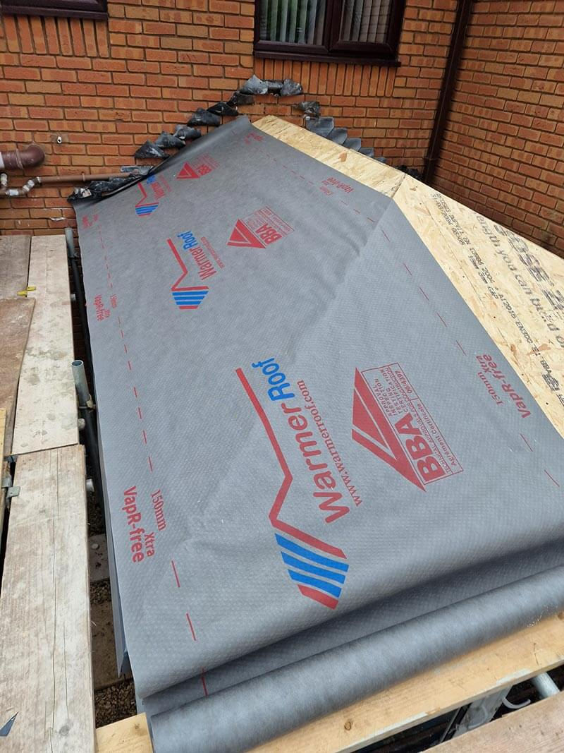 With the roof pods all in place, an eaves protector and breathable, weather roof membrane was installed over the top