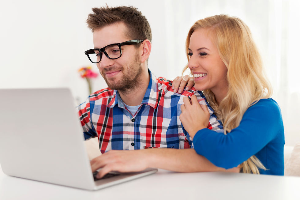 happy-couple-browsing-something-laptop.jpg