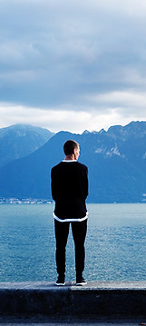 Man Looking Out to the Mountains