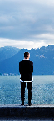 Man Looking Out to the Mountains