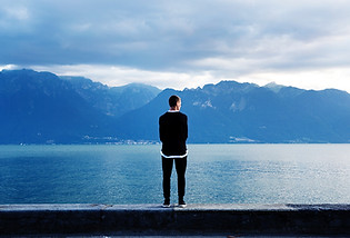 Man Looking Out to the Mountains