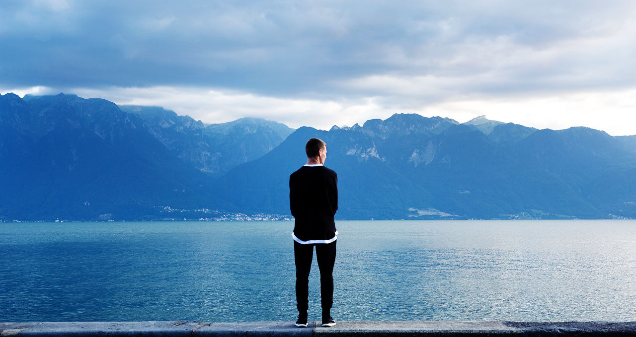 Man Looking Out to the Mountains