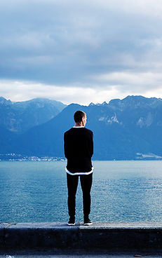 Man Looking Out to the Mountains