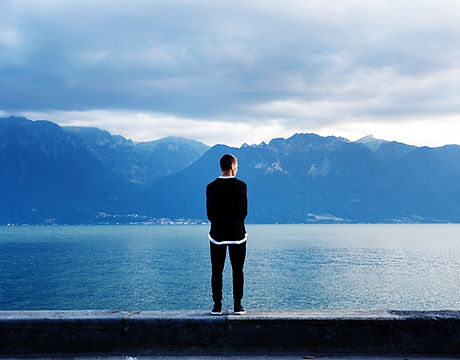 Man Looking Out to the Mountains