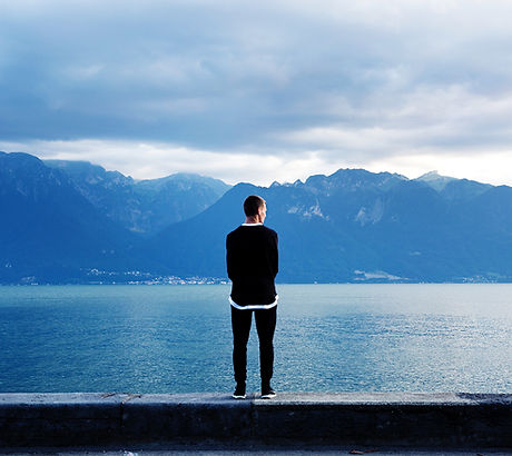 Man Looking Out to the Mountains
