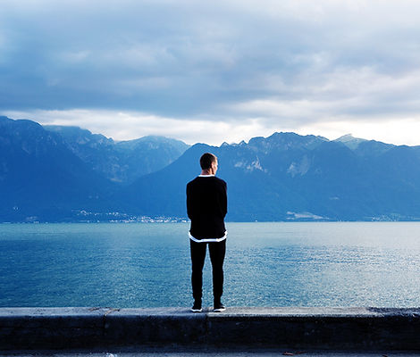 Man Looking Out to the Mountains