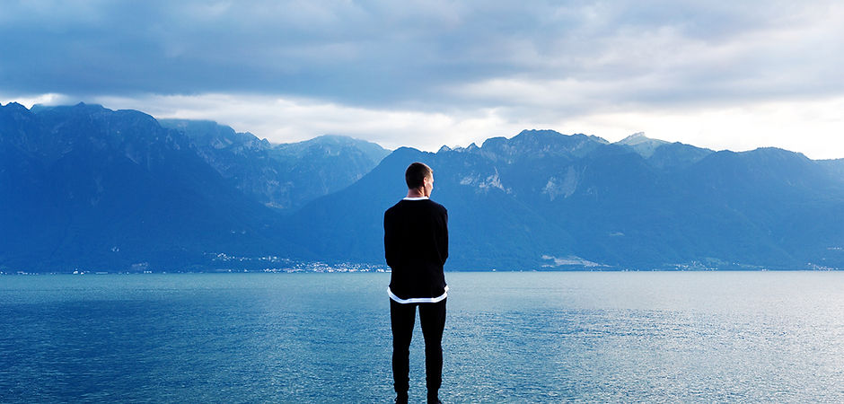 Man Looking Out to the Mountains