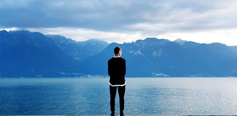 Man Looking Out to the Mountains